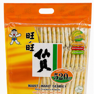A 520g bag of Want-Want Senbei Rice Crackers-Snacks, featuring an orange and yellow packaging design with the brand's cartoon mascot and product contents visible through a clear window.